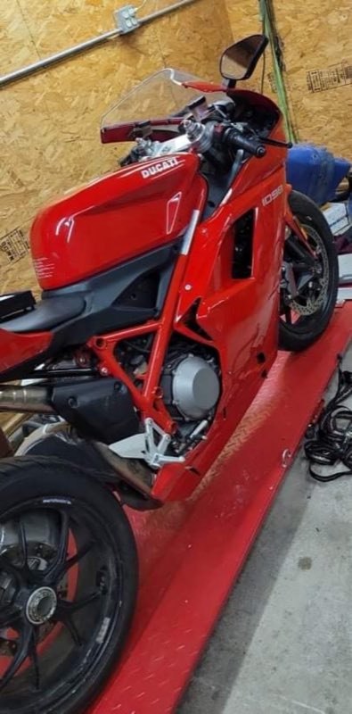 A sportbike up on the lift - they service motorcycles too